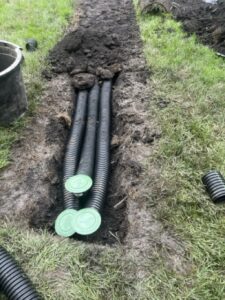 burried downspout for drainage around foundation