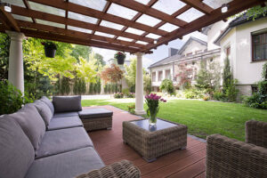 Outdoor patio with furnishings and covered pergola. 